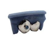 Two-tooth grillz with bezel-set aquamarine gemstones front view 180x – Luxe Grillz