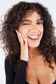 Open face diamond tooth on fang grillz close-up - Luxe Grillz