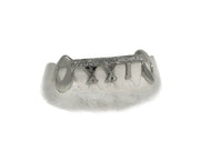 Luxe Grillz close-up photo of custom teeth with diamonds and gold