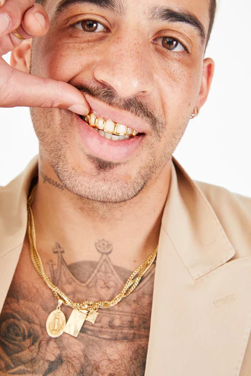 man with top 8 open face white gold grillz