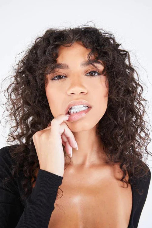 woman with black shirt bottom 8 diamond grillz